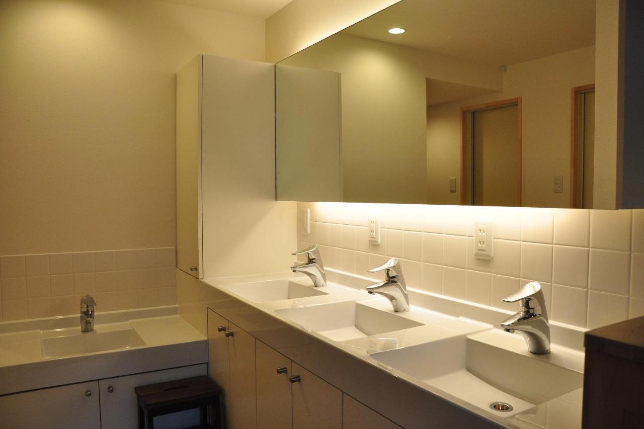 Camera Doppia con Letti Singoli e Bagno in Comune